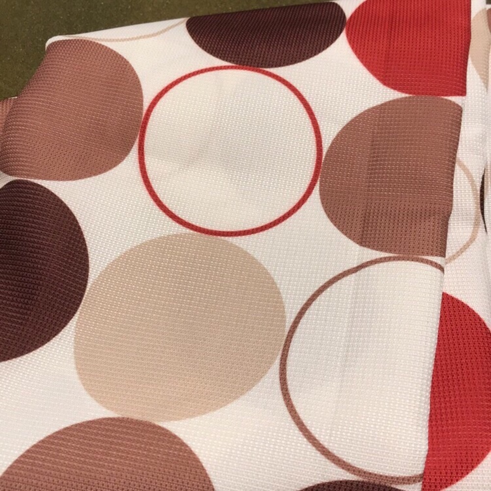 Red, brown, and tan polka dotted shower curtain